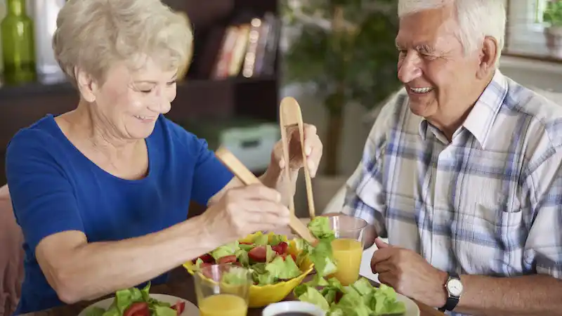Elderly couple eating