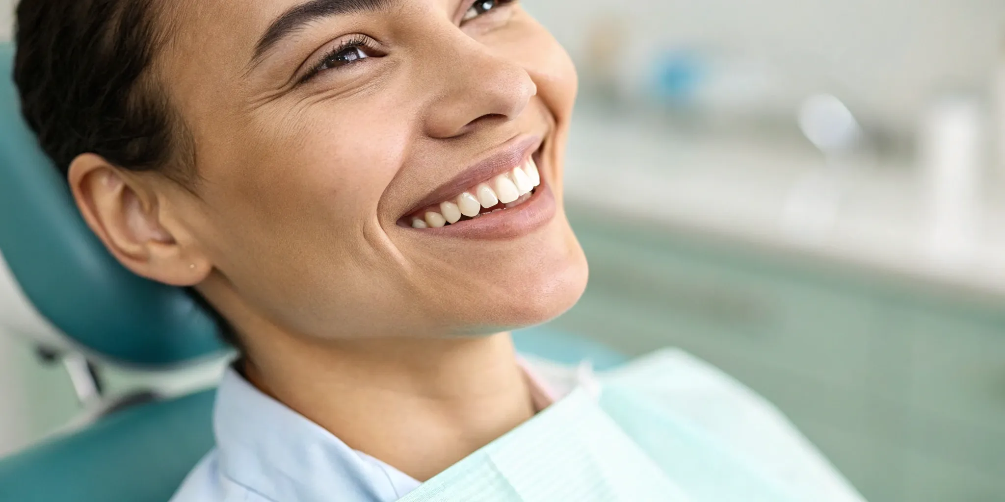 Patient smiling during a free consultation for All-on-4 dental implants.